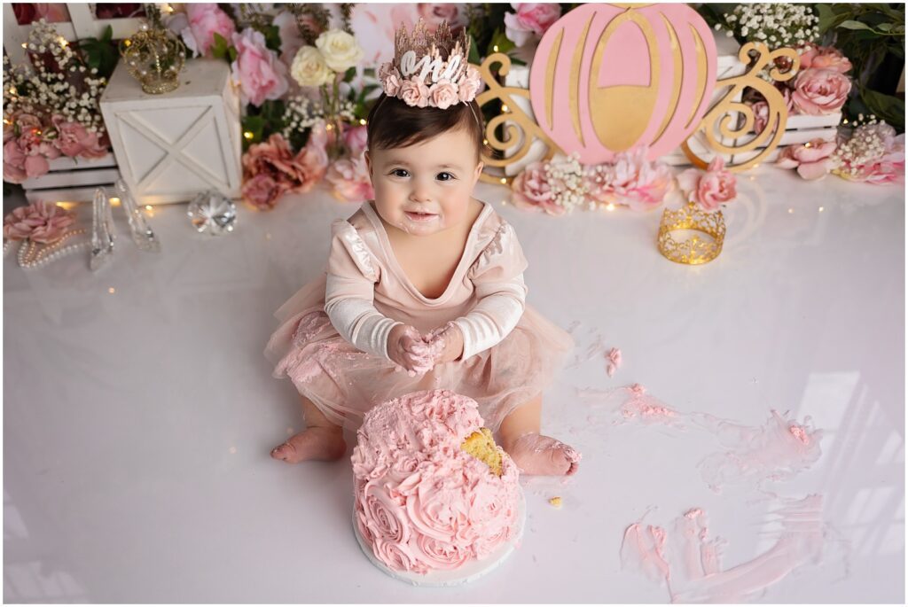 A princess fairytale cake smash designed by best connecticut Fist Birthday photographer serving all of Westchester County NY